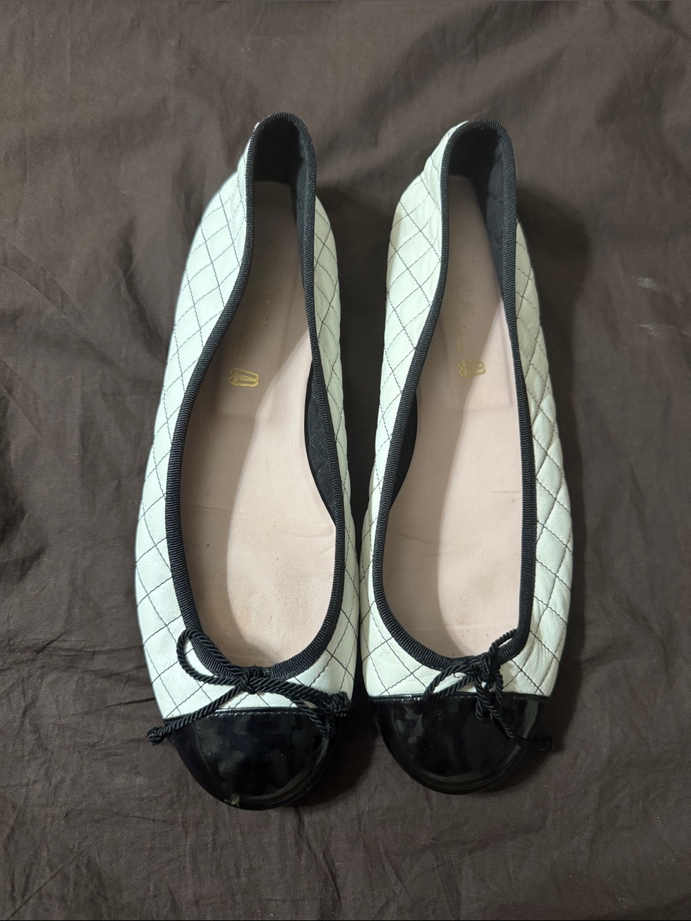 Pretty Ballerinas Quilted White Ballet Flats with Black Cap Toe